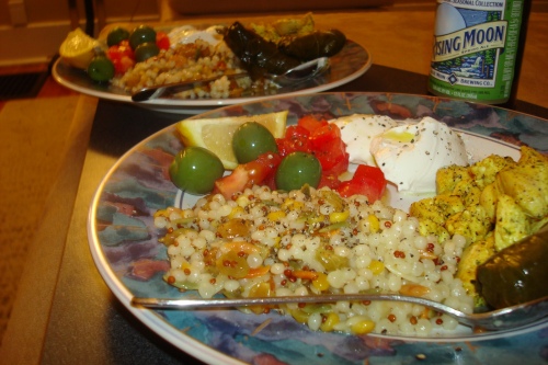 Mediterranean Feast: cous cous, tumeric chicken, tomato olive salad, and dolmas